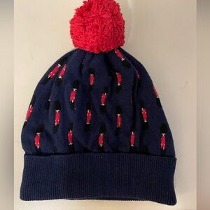 Boden winter bobble hat with tiny Palace Guards print